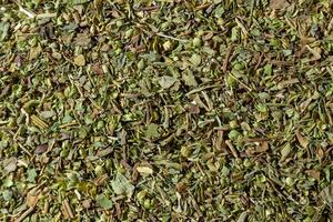 Dry Aromatic Herbs and Flavorful Spices Mix. A Culinary Canvas of Aroma Herb Seasoning. Textured Background for Gourmet Cooking. The Harmonious Combination of Dried Herbs and Spices - Top View photo