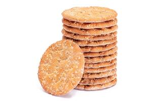 A Stack of Round Salt Crackers with Sesame Isolated on White Background. Dry Snacks - Isolation photo