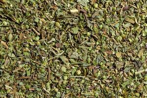 Dry Aromatic Herbs and Flavorful Spices Mix. A Culinary Canvas of Aroma Herb Seasoning. Textured Background for Gourmet Cooking. The Harmonious Combination of Dried Herbs and Spices - Top View photo