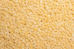 Uncooked Stelline Pasta. A Culinary Canvas of Stelline Macaroni, Creating a Lively and Textured Background for Gourmet Cooking. Dry Pasta. Raw Macaroni - Top View, Flat Lay photo