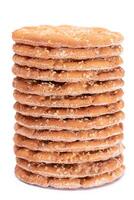 A Stack of Round Salt Crackers with Sesame Isolated on White Background. Dry Snacks - Isolation photo