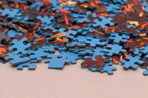 Mixed Peaces of a Colorful Jigsaw Puzzle - Strategy and Solving Problem Concept photo