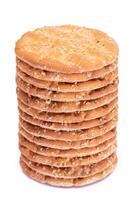A Stack of Round Salt Crackers with Sesame Isolated on White Background. Dry Snacks - Isolation photo