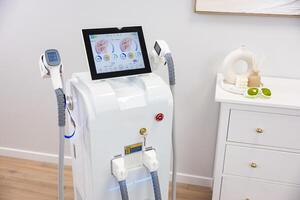 Advanced laser hair removal machine in a modern beauty clinic setting photo