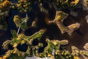 Aerial View of Autumn Landscape with Observation Tower and Ponds photo