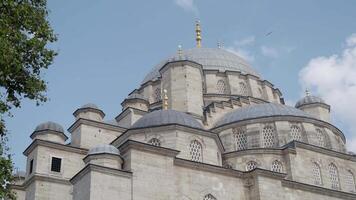 A Majestic Mosque Featuring a Stunning Dome Set Against a Clear, Vibrant Blue Sky video