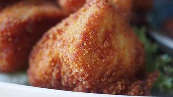 A delightful plate filled with crispy and golden fried snacks that are ready for you to enjoy video