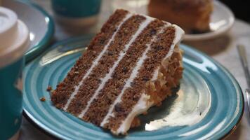 chocolate and cream cake on a plate on table video