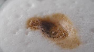 white sugar pouring from a in a paper packet on a coffee cup video
