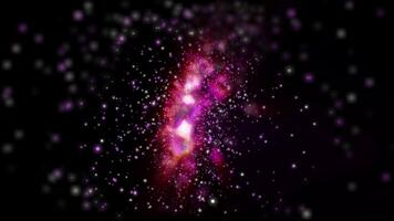 a bright galaxy made of billions of particles glows with neon and moves in space video