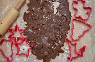 Gingerbread dough for Christmas cookies and cookie cutters.Christmass card and advent calendar concept.Top view.Close up. High quality photo