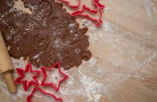 Gingerbread dough for Christmas cookies and cookie cutters.Christmass card and advent calendar concept.Copy space.Close up. High quality photo