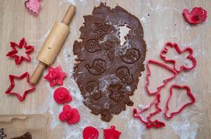 Gingerbread dough for Christmas cookies and cookie cutters.Christmass card and advent calendar concept.Top view.Top view. High quality photo