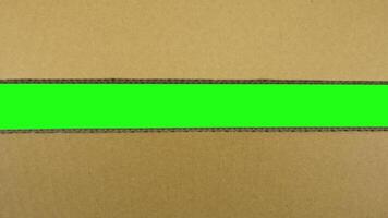 Carton box opening with chromakey inside. Unpacking cardboard, view from top video