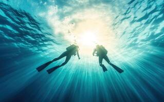 Snorkelers exploring vibrant underwater world, illuminated by sunlight. serene ocean environment creates sense of adventure and tranquility photo