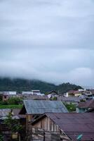Landscape view of residents houses in Takengon city with mountain in the background. Takengon city at the morning photo