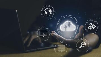 Man using Laptop and showing cloud computing diagram. Networking and internet service concept. photo