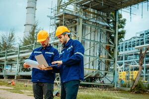 Teamwork Industry in oil refinery equipment Check and check the condition of the machinery system , Engineering concept. photo