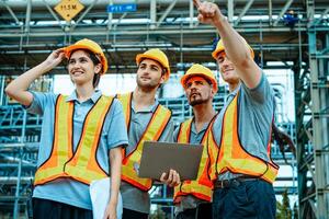 Group of workers teamwork Industry in oil refinery equipment Check and check the condition of the machinery system , Engineering concept. photo