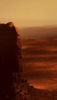 A view of a desert with a rock formation in the foreground video