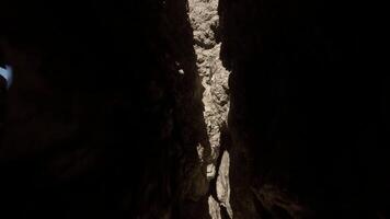 A narrow passage between two large rocks video