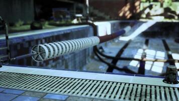 An abandoned swimming pool with a water slide in the center video