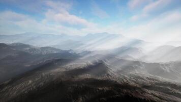 majestic mountain range illuminated by sunbeams from above video