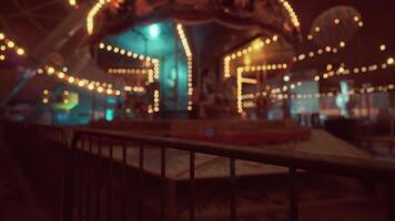 Empty amusement park at night showcasing a deserted carousel and dim lights video