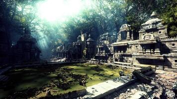 Ancient ruins of Cambodia enveloped in lush greenery during daylight hours video