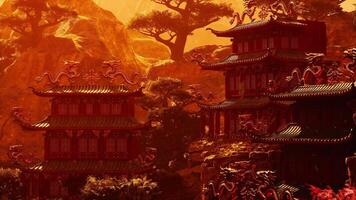 Sunset view of an ancient Asian temple nestled in mountain peaks video