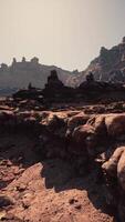 A rocky area with rocks and a mountain in the background video