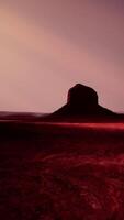 Two large rocks in the middle of a desert video