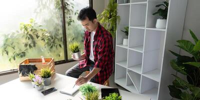 Innovative Plant Enthusiast Using Tablet for Efficient Indoor Plant Management photo
