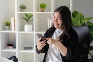 Happy Overweight Office Worker Using Smartphone for Effective Networking photo