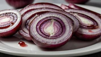 Sliced red onions arranged on a plate, showcasing their vibrant colors and textures. photo
