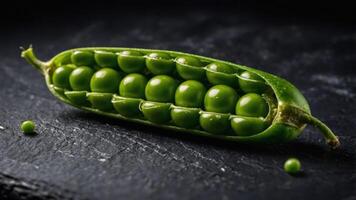 A fresh green pea pod split open, showcasing vibrant peas inside. photo