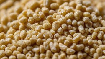 Close-up of small, light-colored cereal grains, showcasing texture and shape. photo