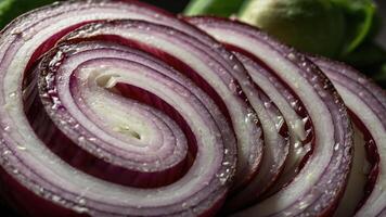 Close-up of sliced red onion showcasing its spiral layers and texture. photo
