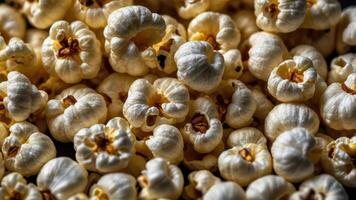 A close-up of fluffy, popped popcorn kernels, perfect for snacking or movie nights. photo