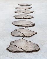 Cracked and broken concrete path photo