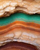 Colorful rock layers in a cave photo