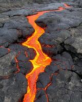 Flowing lava stream on volcanic surface photo