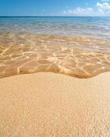 Tranquil beach scene with crystal clear water and golden sand photo