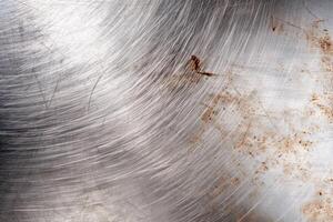 Scratched metal surface with rust and damage photo