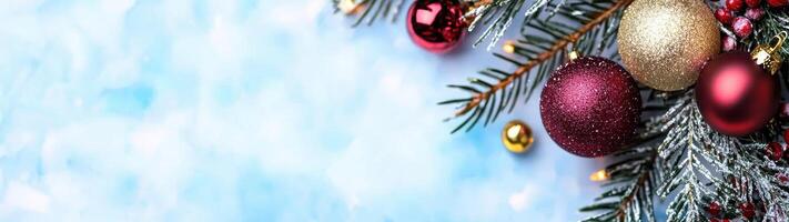 festive christmas ornaments and pine branches on snowy background photo