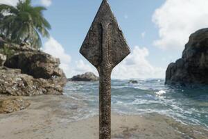 ancient stone spearhead on tropical beach photo