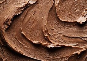 Smooth and creamy chocolate frosting texture photo