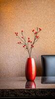 red berry branch in vase on table photo