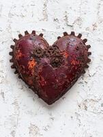 Rusty mechanical heart on textured background photo