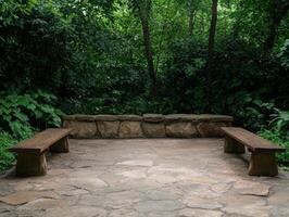 Rustic outdoor seating area in lush forest photo